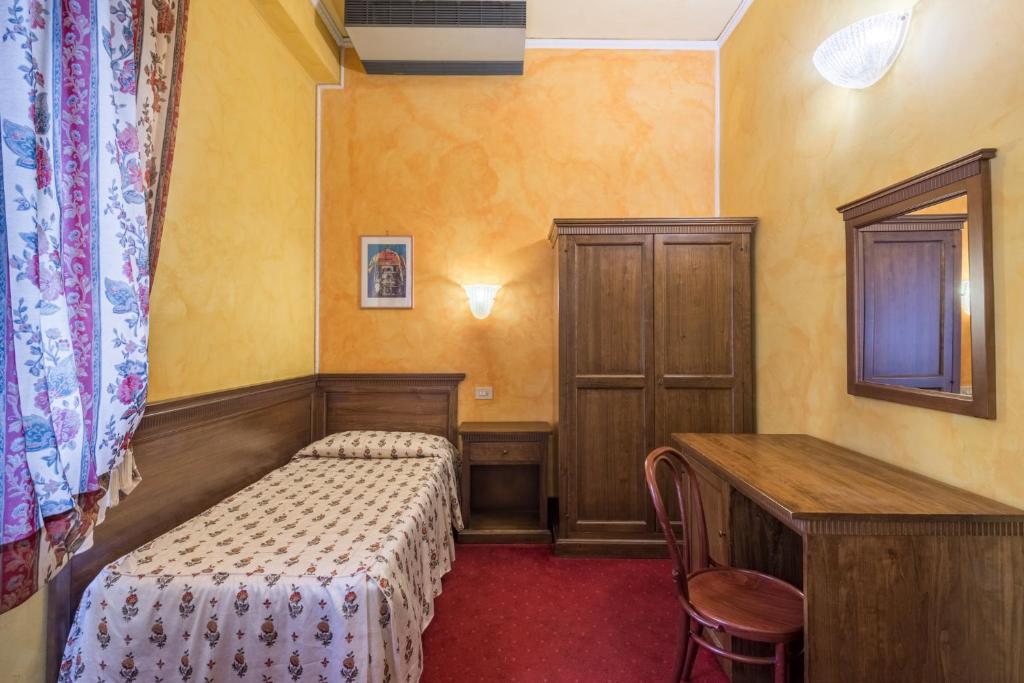 Postel nebo postele na pokoji v ubytování Hotel Minerva Palace