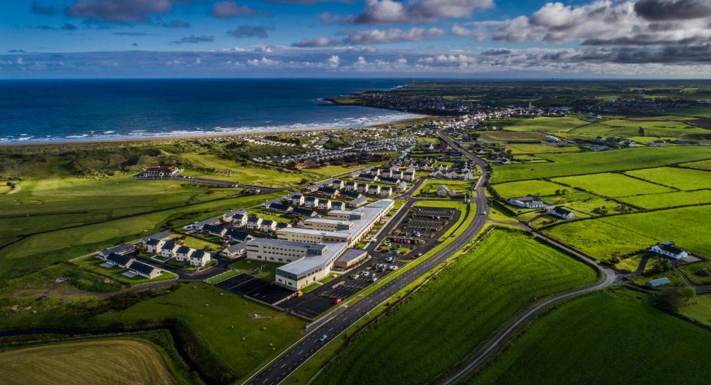 an aerial view of a resort next to the ocean at Diamond Coast Hotel in Enniscrone