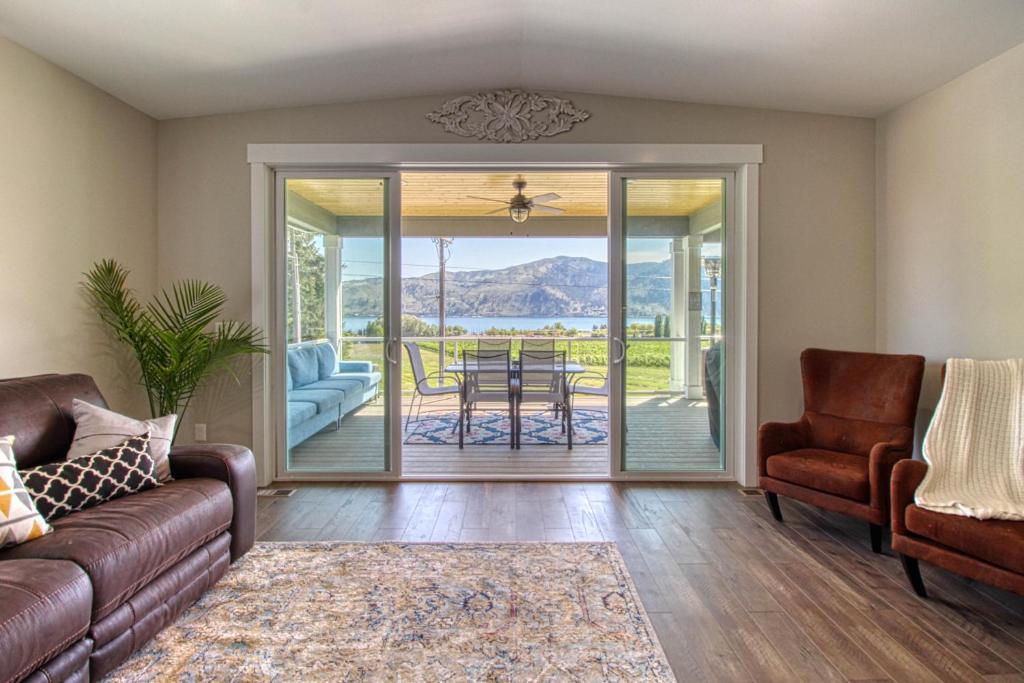 a living room with a couch and chairs and a table at Tiffany Lake House in Manson