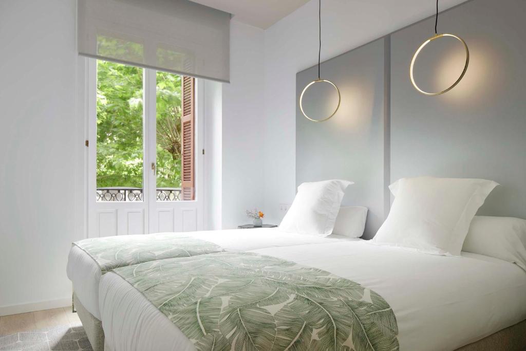 Posteľ alebo postele v izbe v ubytovaní Avenida Suite by FeelFree Rentals