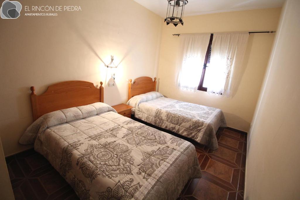 Postel nebo postele na pokoji v ubytování El Rincon de Piedra