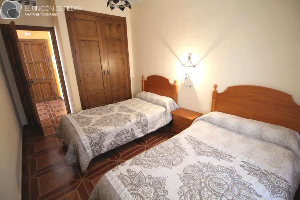Postel nebo postele na pokoji v ubytování El Rincon de Piedra