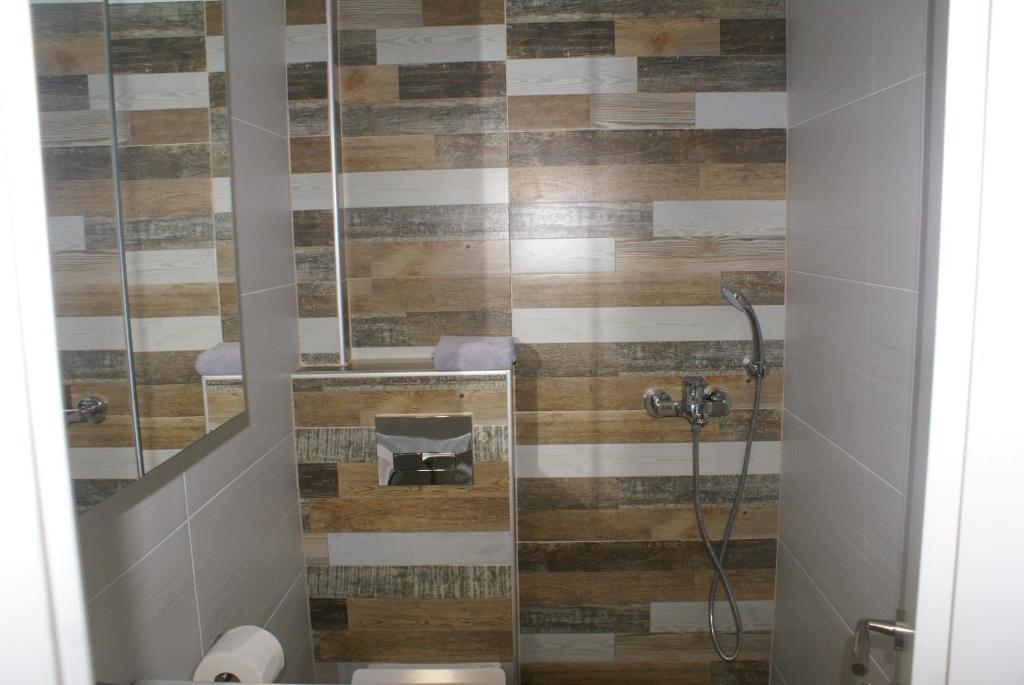Koupelna v ubytování Nostos Rooms Ammouliani
