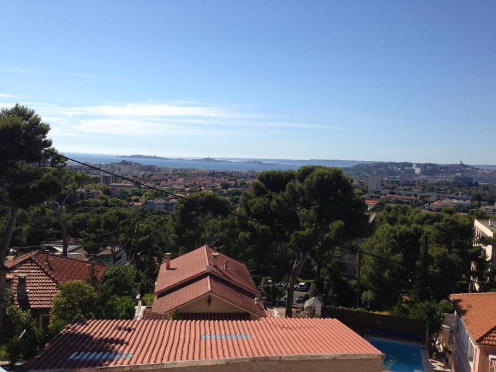 a view of a city from the roof of a building at Gîte Polema in Marseille