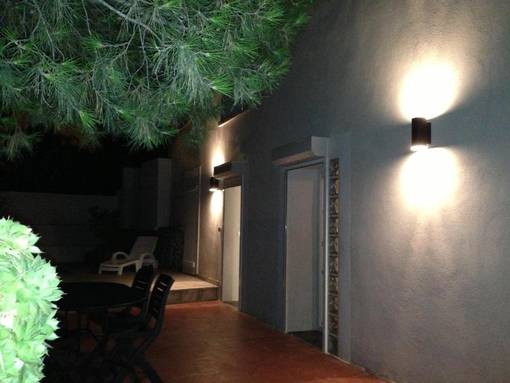 a room with a table and lights on the ceiling at Gîte Polema in Marseille