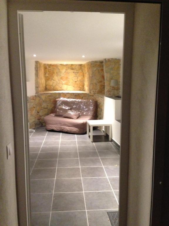 a view of a living room with a couch at Gîte Polema in Marseille