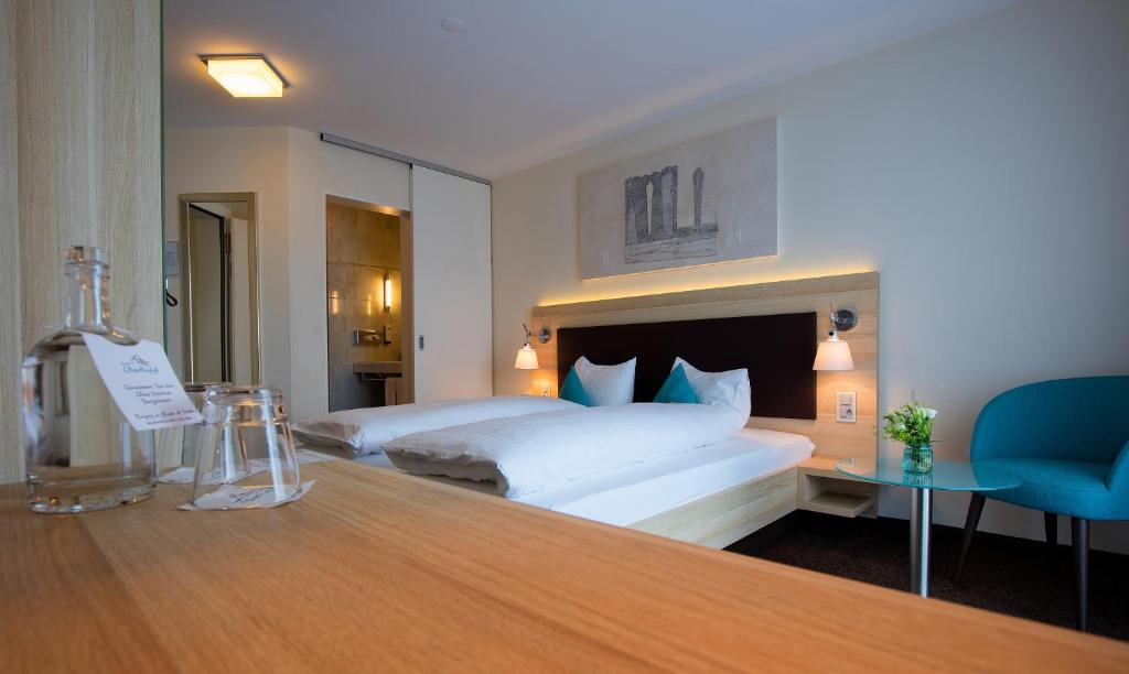 Postel nebo postele na pokoji v ubytování Hotel Oberland