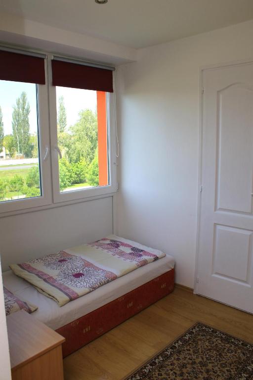 Postel nebo postele na pokoji v ubytování Touring & Sport Hotel Siófok