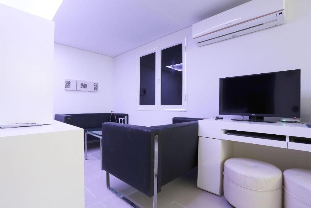 TV a/nebo společenská místnost v ubytování Q Hotel