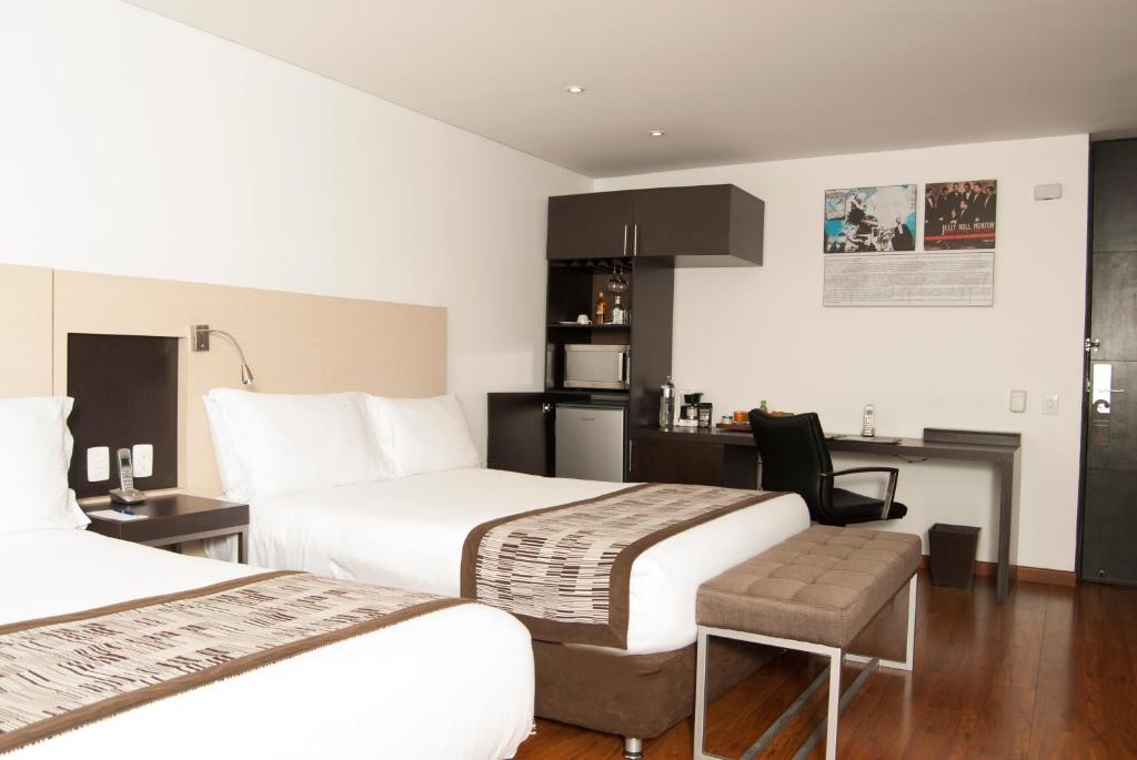 Postel nebo postele na pokoji v ubytování Hotel Jazz Apartments