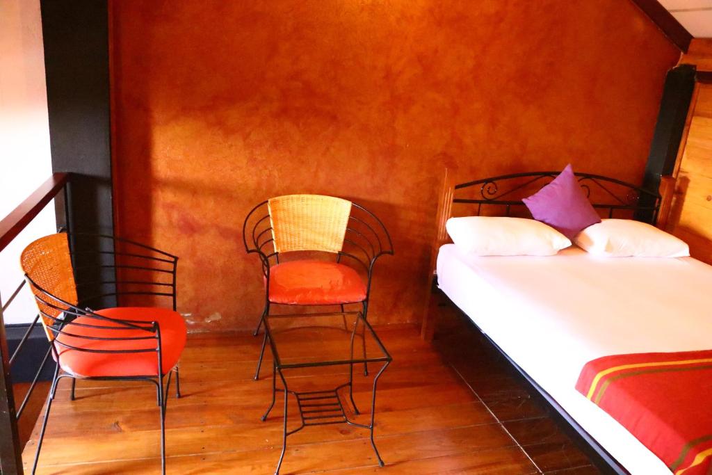 Postel nebo postele na pokoji v ubytování Amansara Bungalow