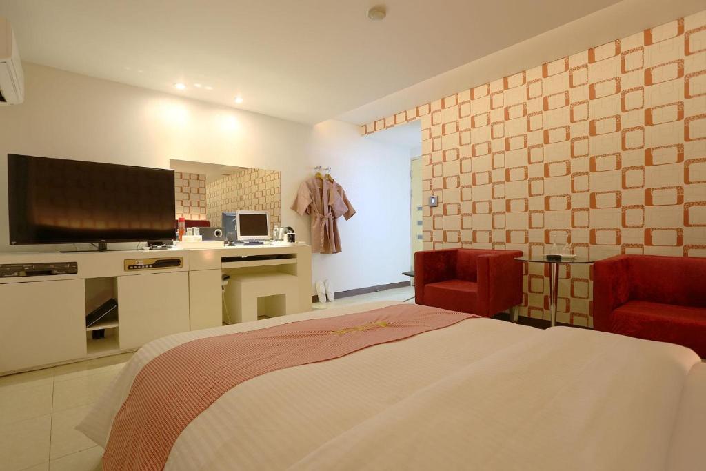 Kuchyň nebo kuchyňský kout v ubytování Q Hotel