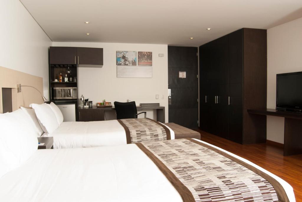 Postel nebo postele na pokoji v ubytování Hotel Jazz Apartments