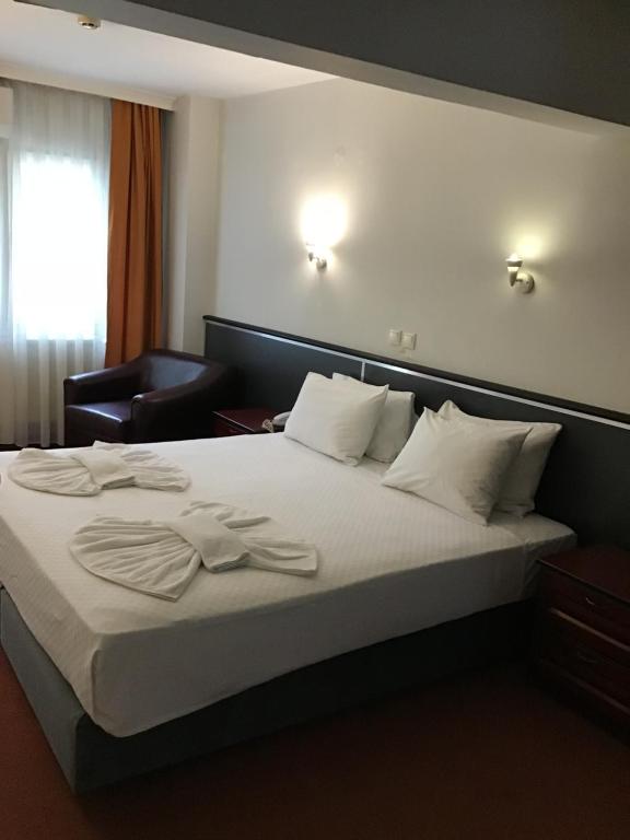 מיטה או מיטות בחדר ב-Hotel Balca