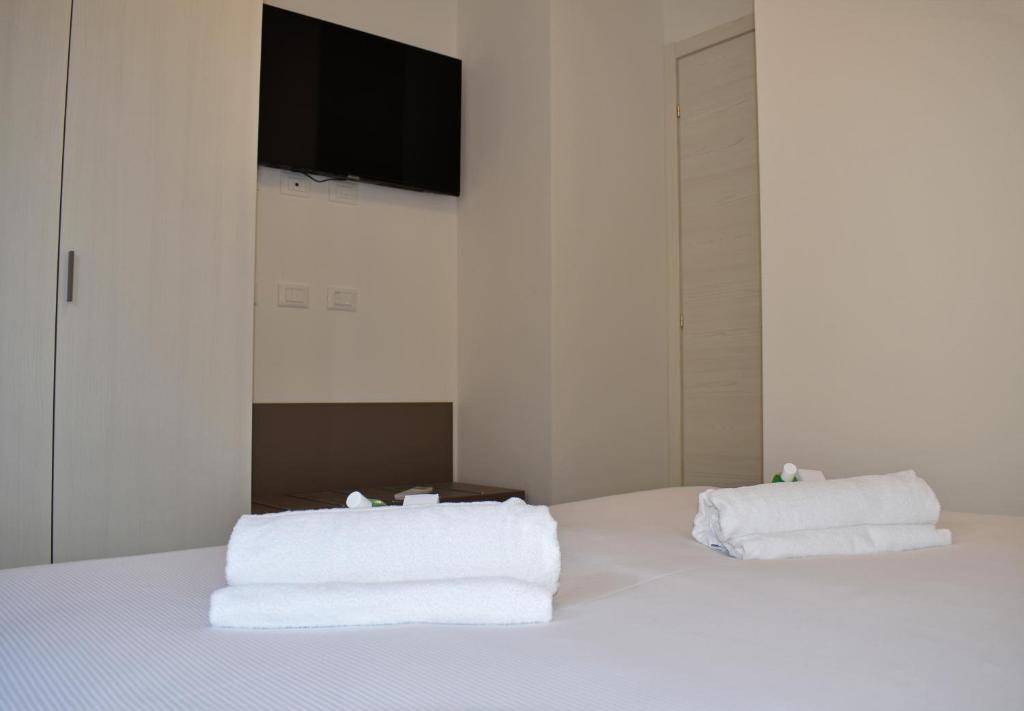 A bed or beds in a room at Residence Lake Como