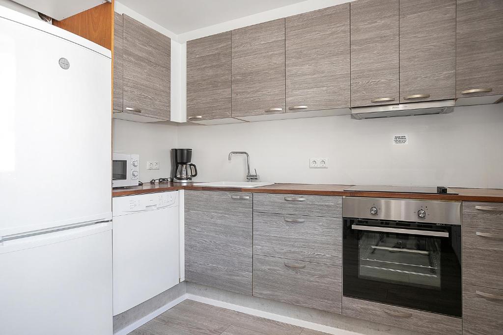 Kuchyň nebo kuchyňský kout v ubytování Stay Apartments Einholt