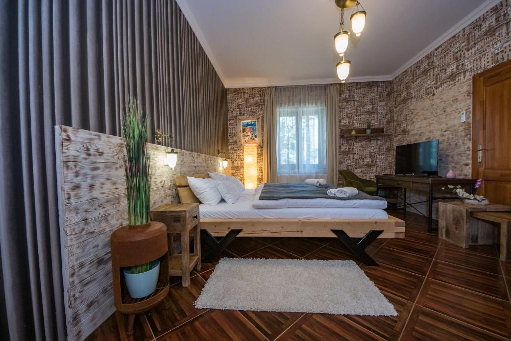 Postel nebo postele na pokoji v ubytování Platan Garden Rooms & Restaurant