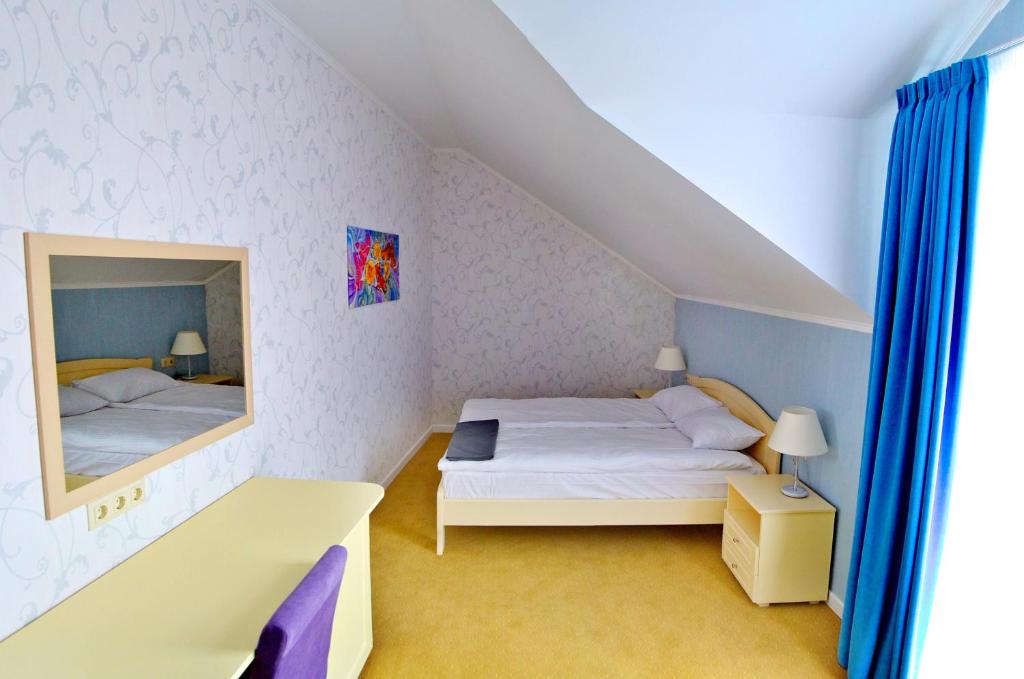 Postel nebo postele na pokoji v ubytování Hotel Ajur