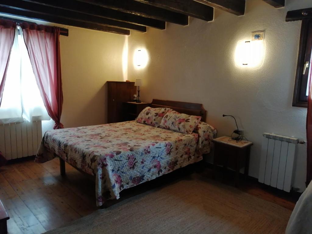 Postel nebo postele na pokoji v ubytování Agroturismo Iturbe