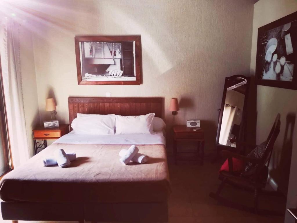 Postel nebo postele na pokoji v ubytování Guesthouse Axieros