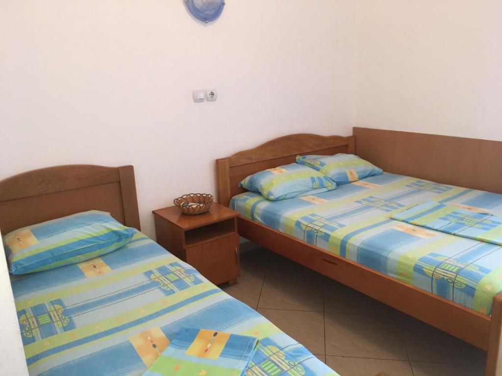 Postel nebo postele na pokoji v ubytování Apartmani Vuković
