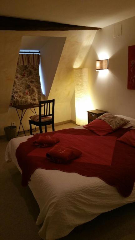 Postel nebo postele na pokoji v ubytování Chambres touristiques La Cour Des Hôtes