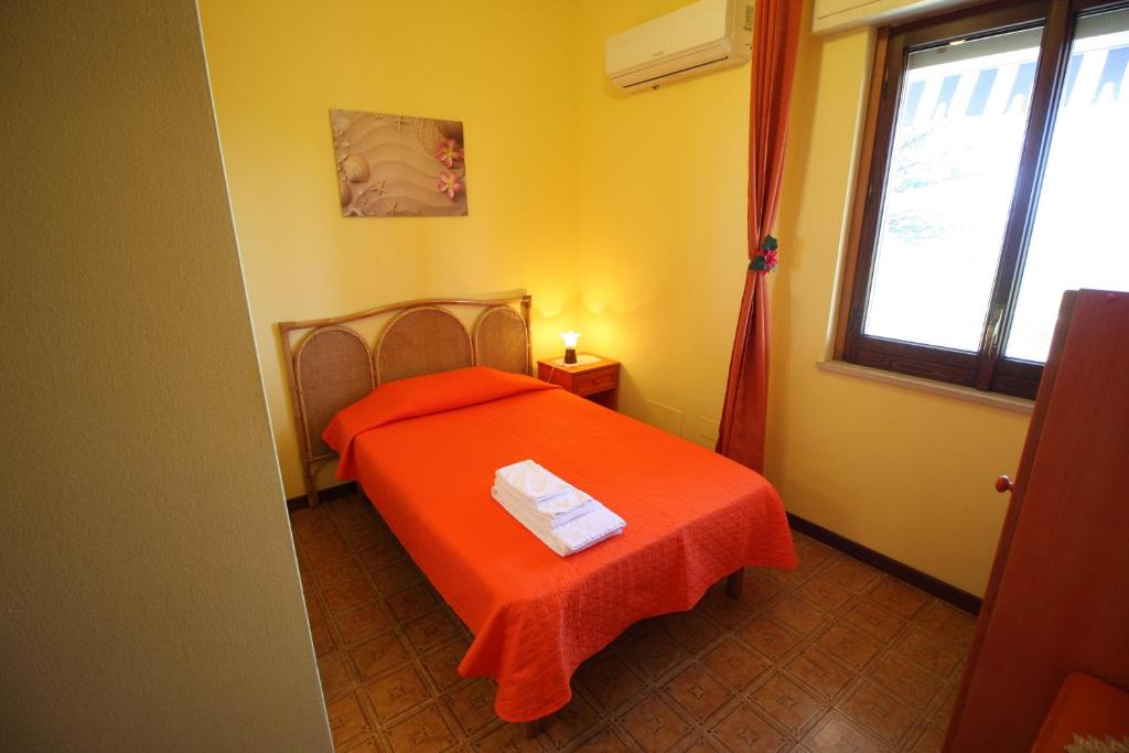 A bed or beds in a room at B&B Villa Rosa
