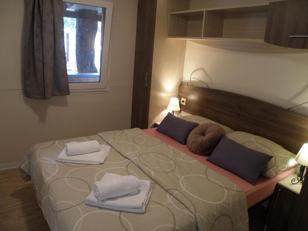 Postel nebo postele na pokoji v ubytování Mobile homes Marita
