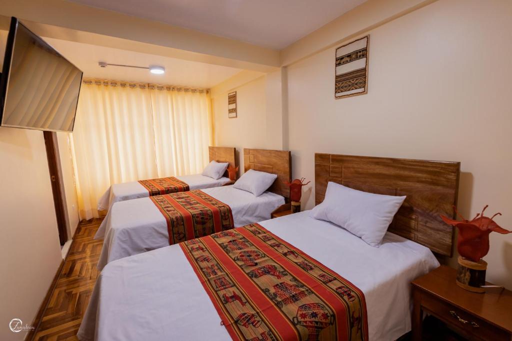 Postel nebo postele na pokoji v ubytování Quechua Hostal Recoleta