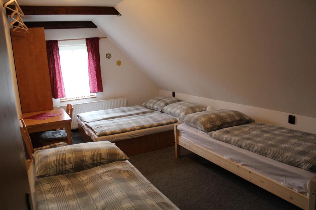 Postel nebo postele na pokoji v ubytování Penzion "V Zelený"