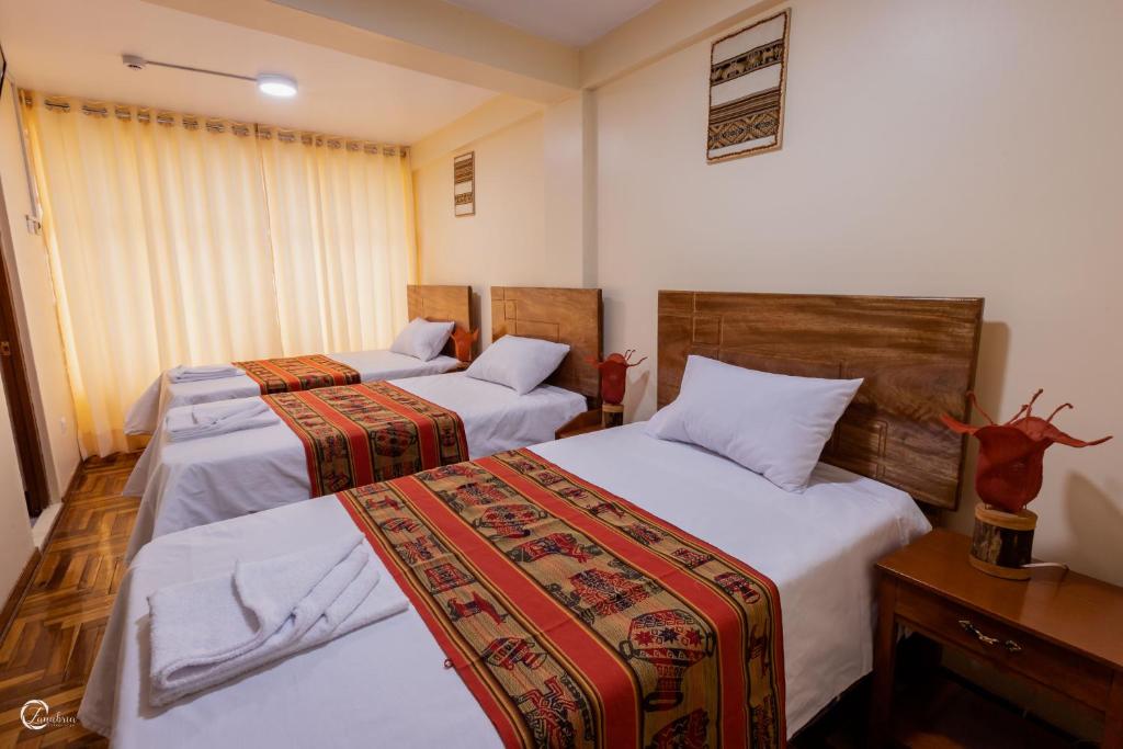 Postel nebo postele na pokoji v ubytování Quechua Hostal Recoleta