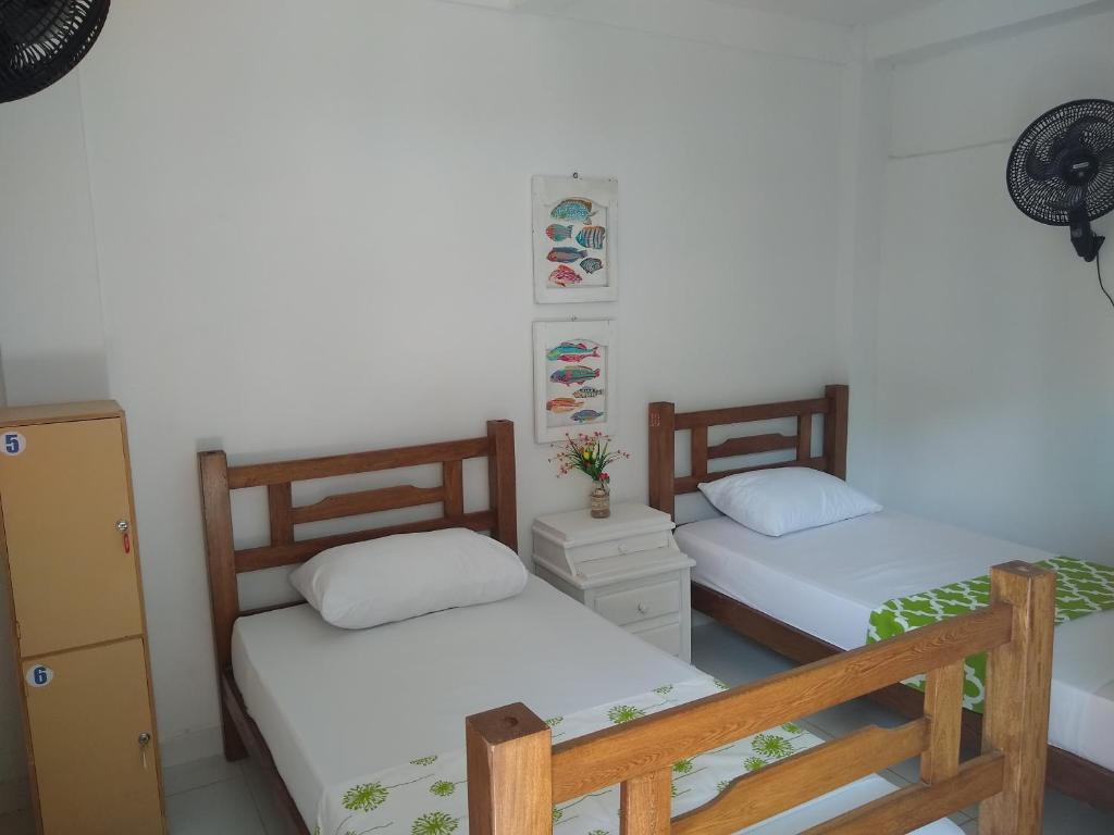 Voodi või voodid majutusasutuse Hostal Palohe Taganga toas