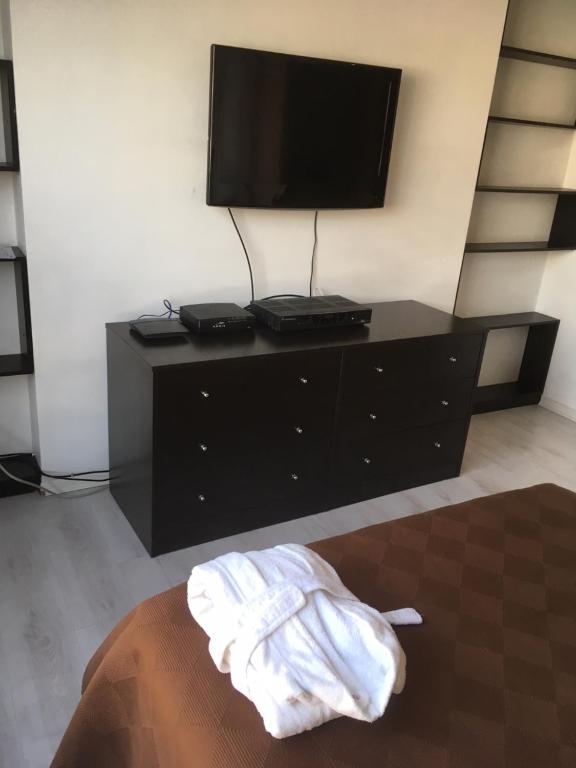 TV a/nebo společenská místnost v ubytování Suites Parque Real