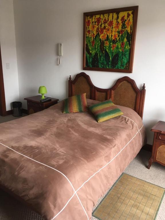 Postel nebo postele na pokoji v ubytování Suites Parque Real