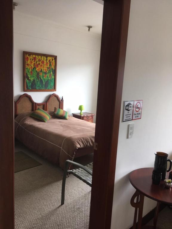 Postel nebo postele na pokoji v ubytování Suites Parque Real