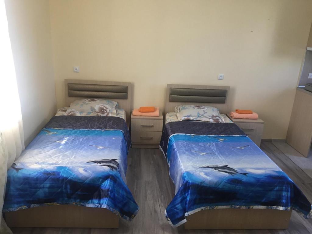 Postel nebo postele na pokoji v ubytování Guest House Koba