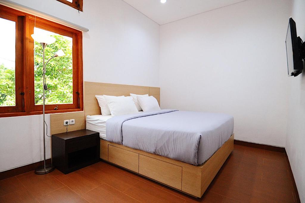 Postel nebo postele na pokoji v ubytování Kamala House