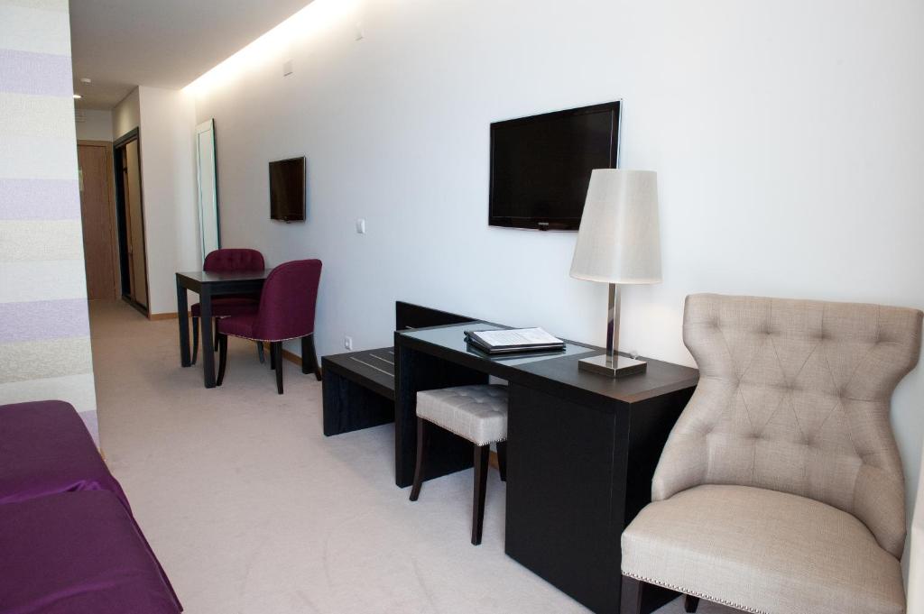 TV a/nebo společenská místnost v ubytování Atlantida Mar Hotel