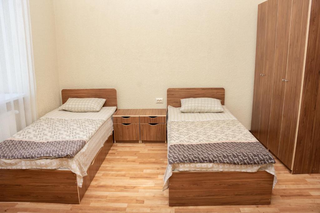Postel nebo postele na pokoji v ubytování Monada Hotel & Hostel