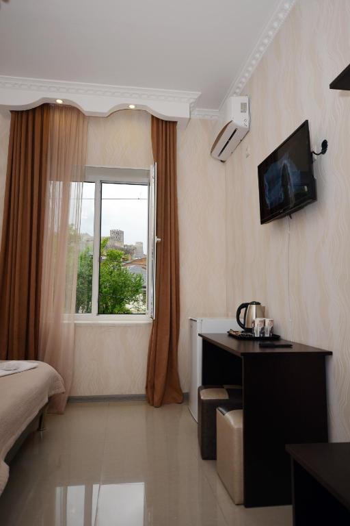 TV a/nebo společenská místnost v ubytování Hotel Like