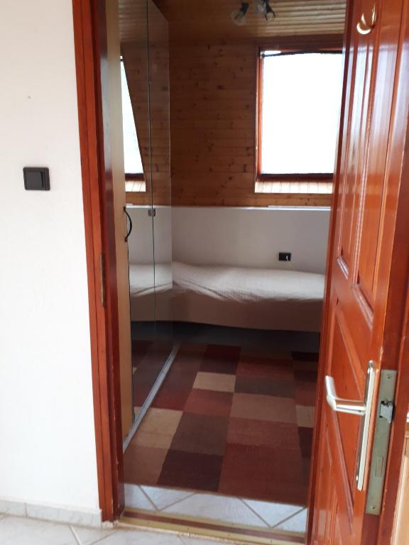 Posteľ alebo postele v izbe v ubytovaní Attila-Apartman Budaörs