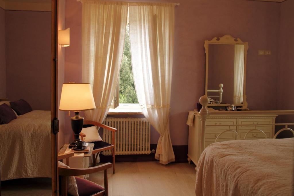 Posteľ alebo postele v izbe v ubytovaní Casa Soleluna B&B
