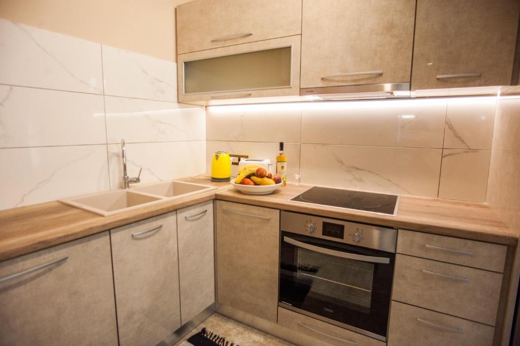 Kuchyň nebo kuchyňský kout v ubytování Monteduca Apartments