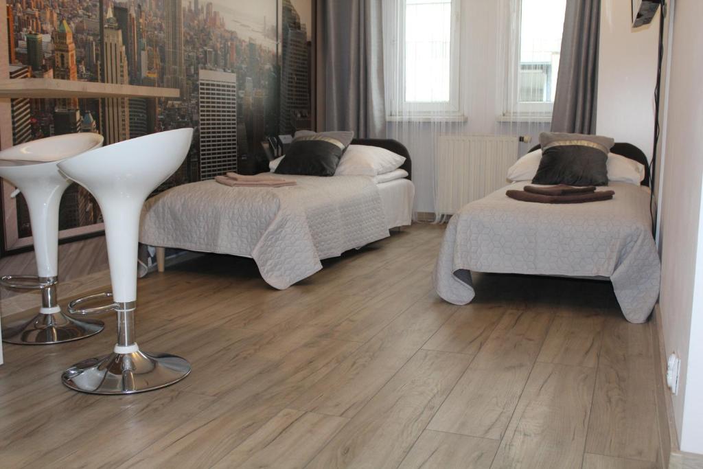 Posteľ alebo postele v izbe v ubytovaní Apartamenty przy Starym Rynku
