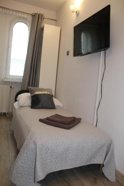 Televízia a/alebo spoločenská miestnosť v ubytovaní Apartamenty przy Starym Rynku