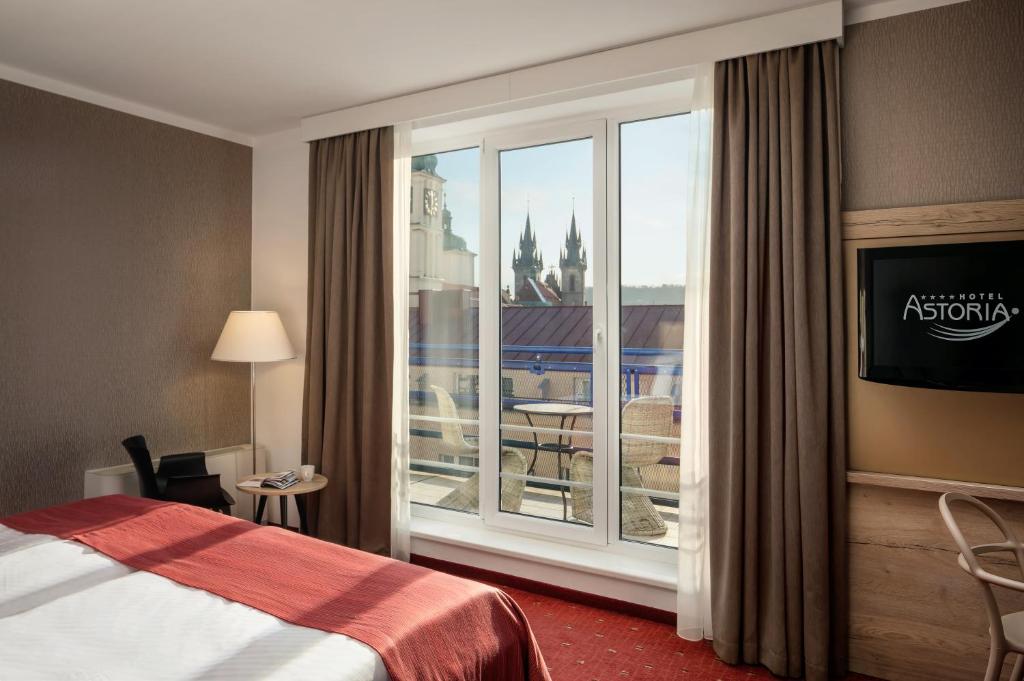 Postel nebo postele na pokoji v ubytování Astoria Hotel