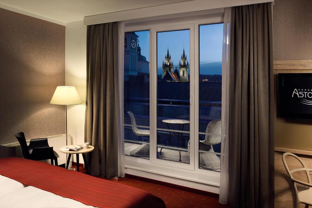 Postel nebo postele na pokoji v ubytování Astoria Hotel