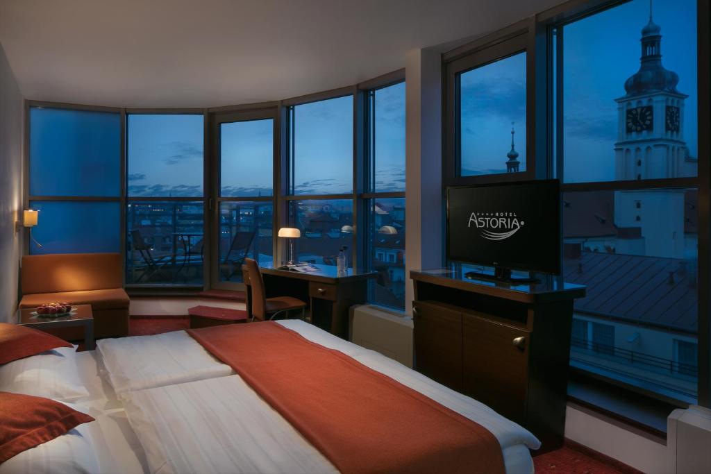 Postel nebo postele na pokoji v ubytování Astoria Hotel
