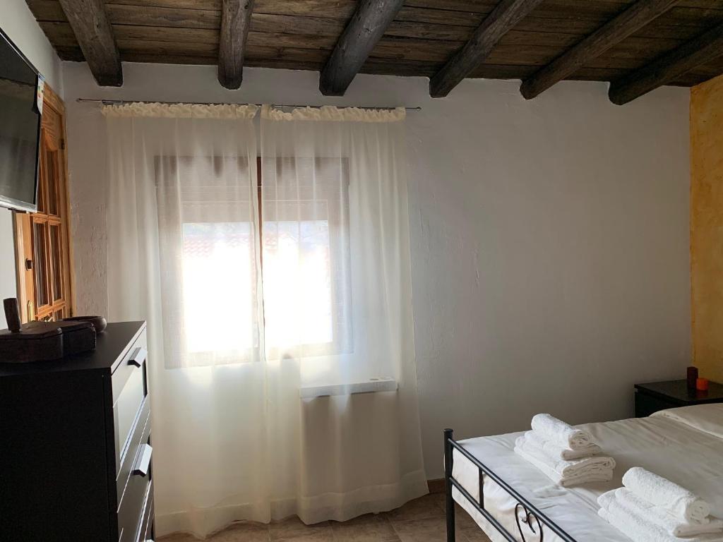 Postel nebo postele na pokoji v ubytování Casa Castillo