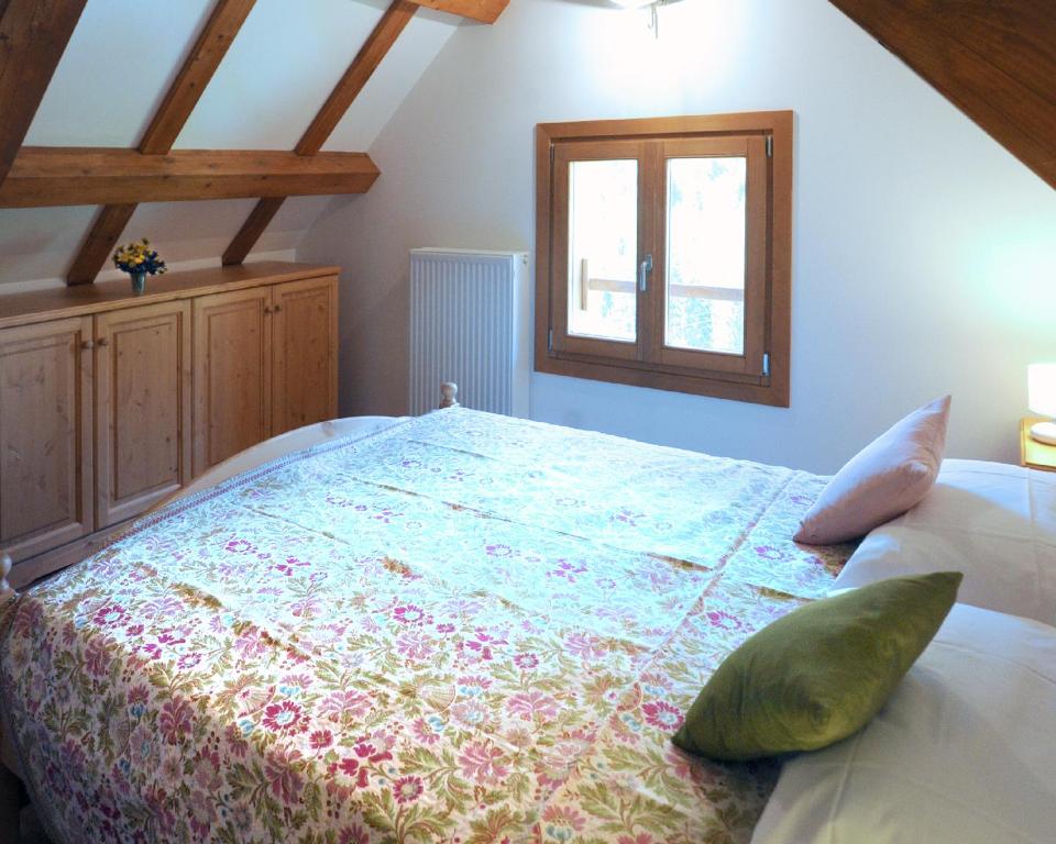 En eller flere senger på et rom på Albergo Diffuso Ravascletto
